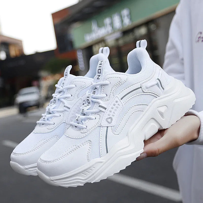 Women's white and moonlight coloured sports shoes with mesh upper and thick sole