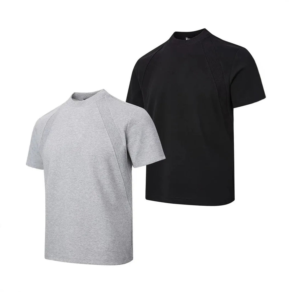 Man wearing a loose fit grey short sleeve top with visible air layer stitching texture.