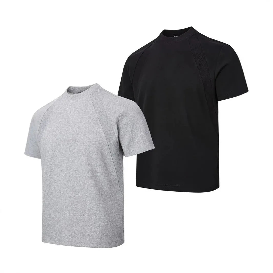 Man wearing a loose fit grey short sleeve top with visible air layer stitching texture.