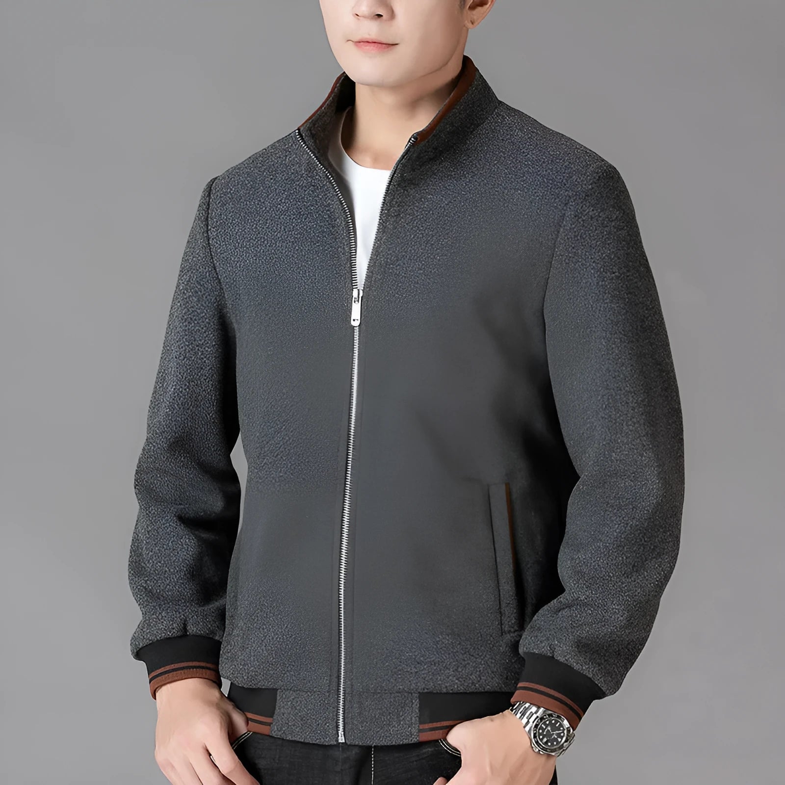 Men's grey sports-style fleece jacket with long sleeves and pockets on a hanger.