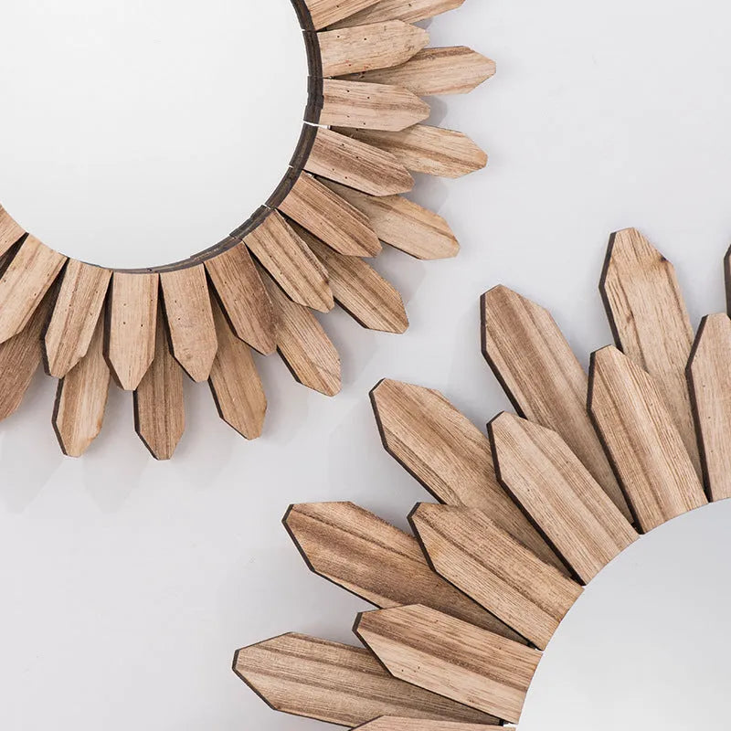 European rustic solid wood circular hanging mirror in baked colour on a wall.