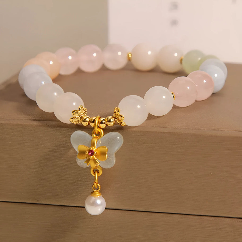 Women's crystal bracelet with natural Morganite butterfly pendant in colourful gemstone tones.
