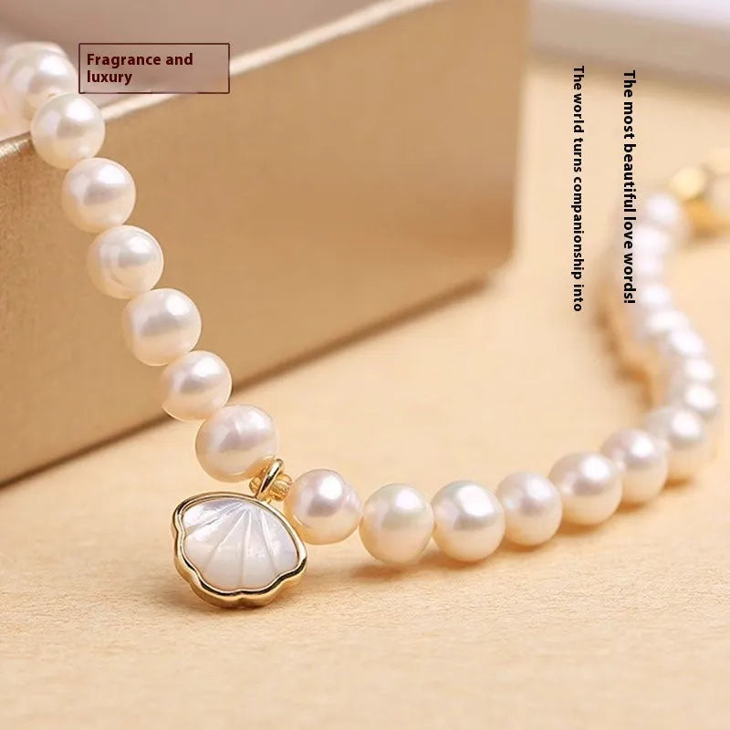 Women's freshwater pearl fan bracelet with 5-6mm pearls on elastic or chain fitting