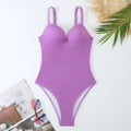 Women's black one-piece swimsuit with sunken stripe pattern, sleeveless design