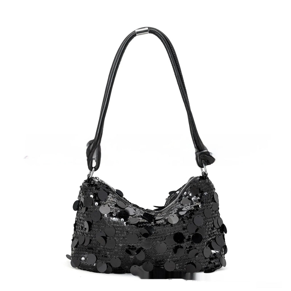 Women's crossbody bag in gold colour showing sandwich pocket design and single shoulder strap