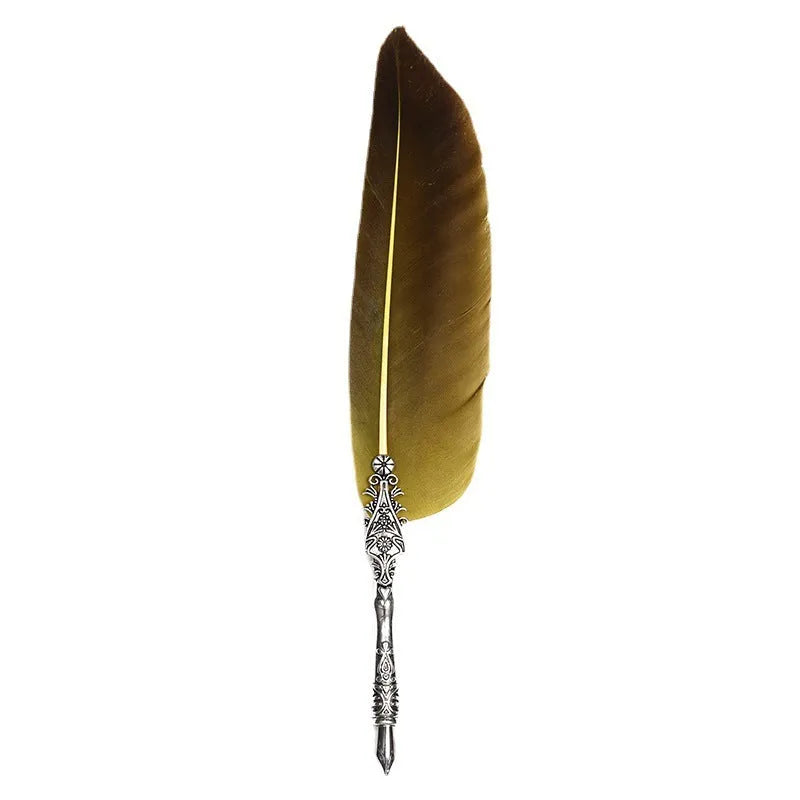 Vintage feather dip pen with zinc alloy shell in various colour options on a desk.