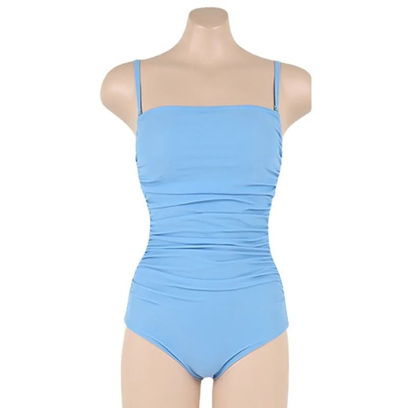 Sling style one-piece swimsuit with belly pleating in blue, white, yellow or black solid colours