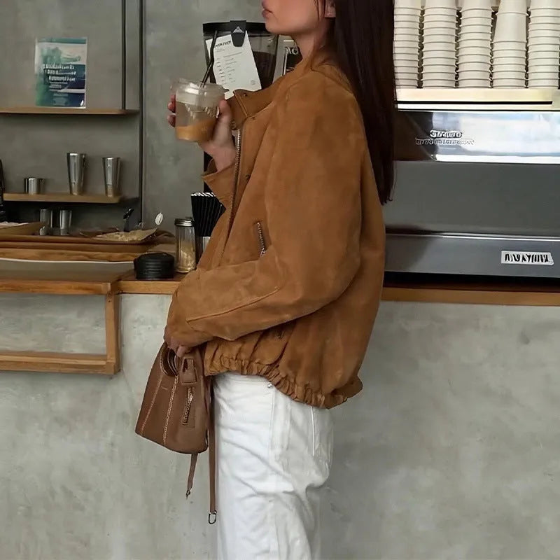 Loose fit solid colour retro jacket with long sleeves on mannequin