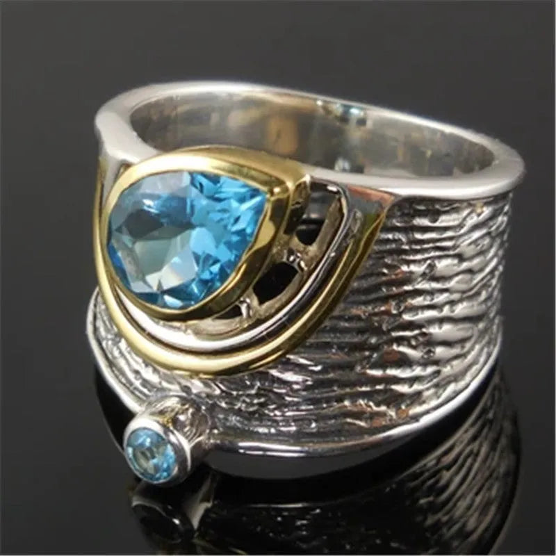 Blue Chinese style zircon ring with drop shape design and inlaid rhinestone detailing on alloy band