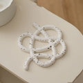 Ceramic heat proof mat in irregular shape protecting dining table from hot pan