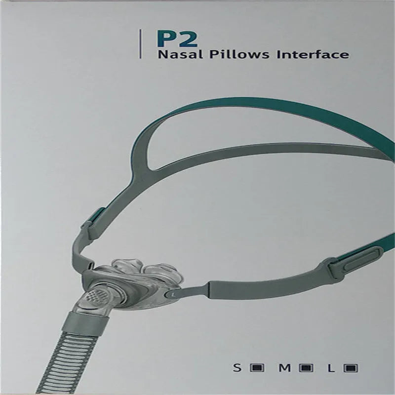Ventilator nasal pillow mask kit with plastic frame, silicone nose cushion, and adjustable headband.