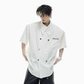 Men's loose fit casual short-sleeved summer shirt with metal buttons and splicing design