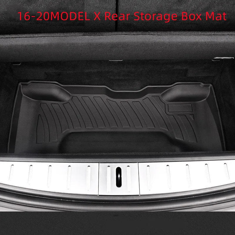 Black rubber floor mat for Tesla car interior with textured TPE footrest section.