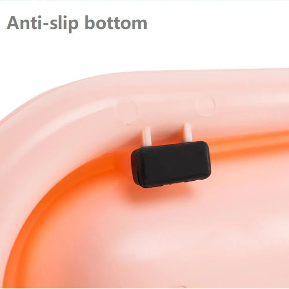 Green weighted pet bowl with anti-slip feet for cats and dogs on a floor.