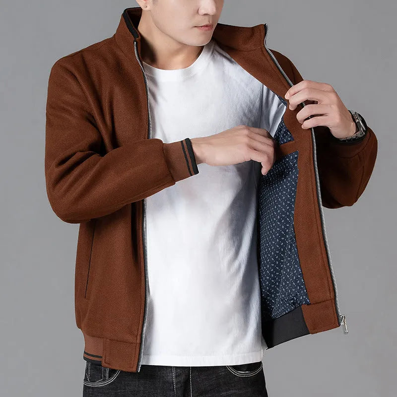 Men's grey sports-style fleece jacket with long sleeves and pockets on a hanger.