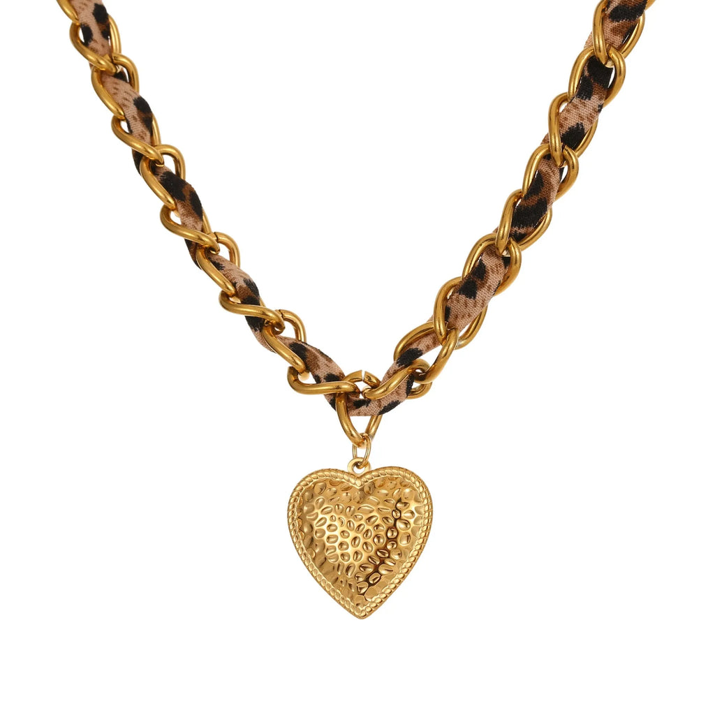 Leopard Love stainless steel necklace with geometric heart or sun pendant on a gold plated adjustable chain.