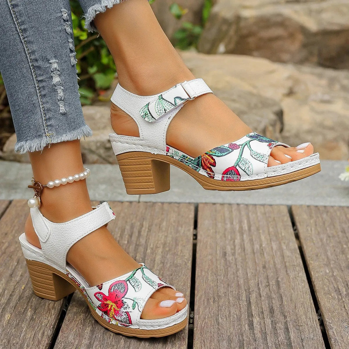 White women's casual high heel sandals with a Velcro strap buckle on a rubber sole.