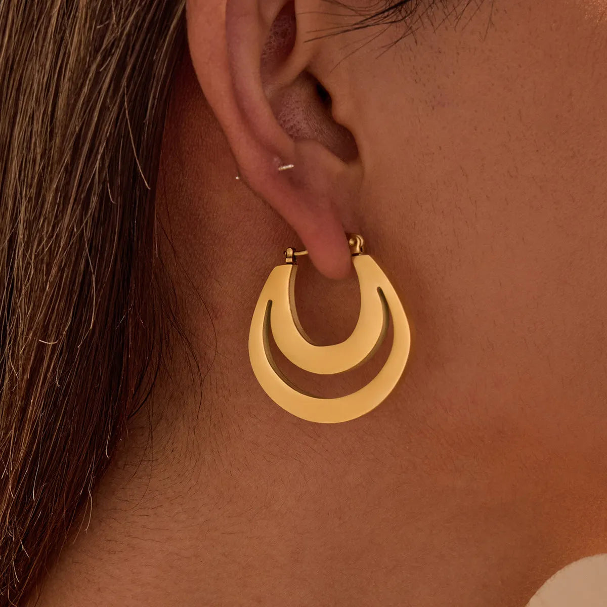 Geometric French earrings with 18K gold plating on stainless steel featuring round ring elements