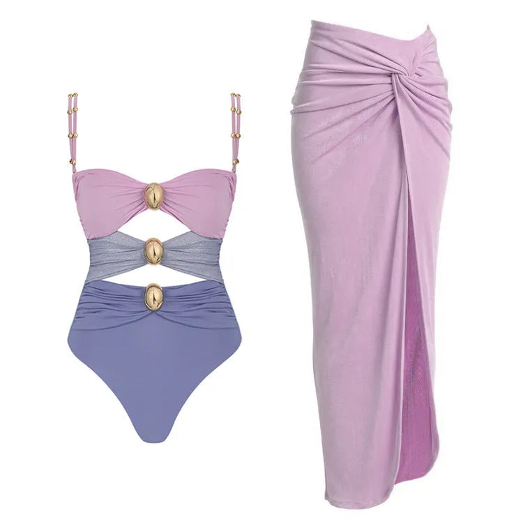 Women's solid colour one-piece swimsuit with gold buttons and detachable matching skirt