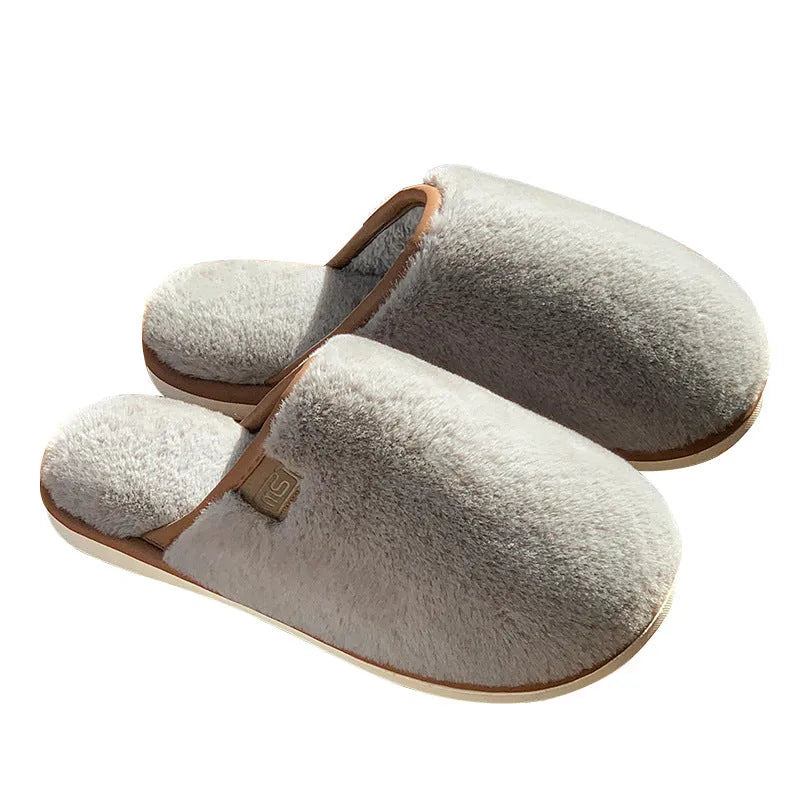 Winter plush slippers in blue colour with non-slip PVC soles, showing car stitching detail