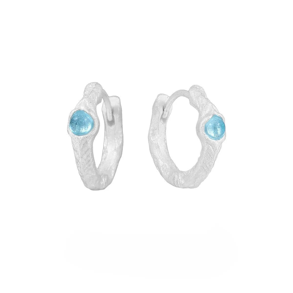 925 sterling silver geometric ear clip with burnt silver electroplated finish and round design elements.