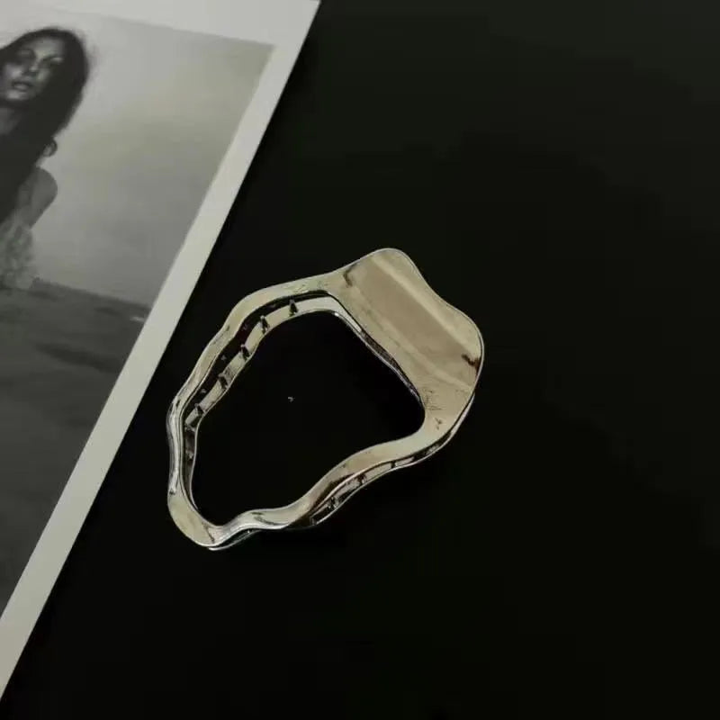 Women's zinc alloy hair barrette in gold colour with a triangle geometric design.