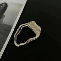 Women's zinc alloy hair barrette in gold colour with a triangle geometric design.