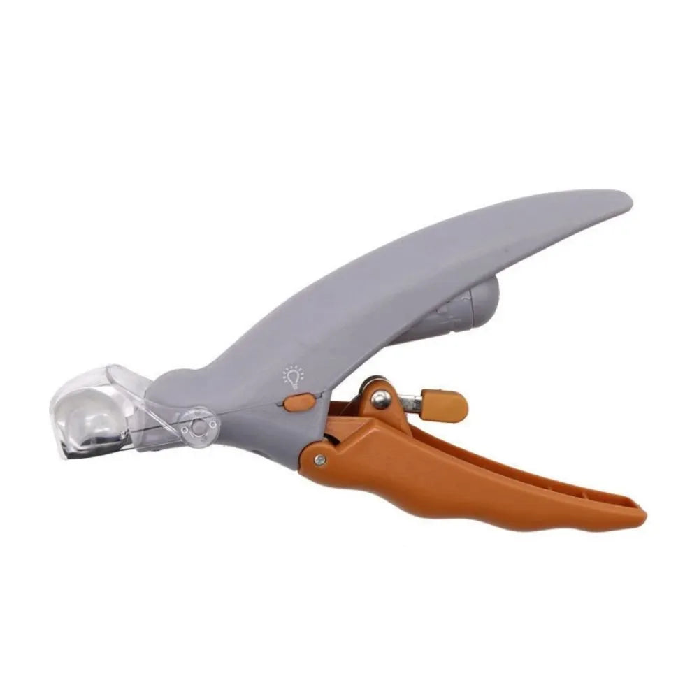 Yellow pet nail clipper with built-in LED light and magnifying window for trimming dog or cat nails.