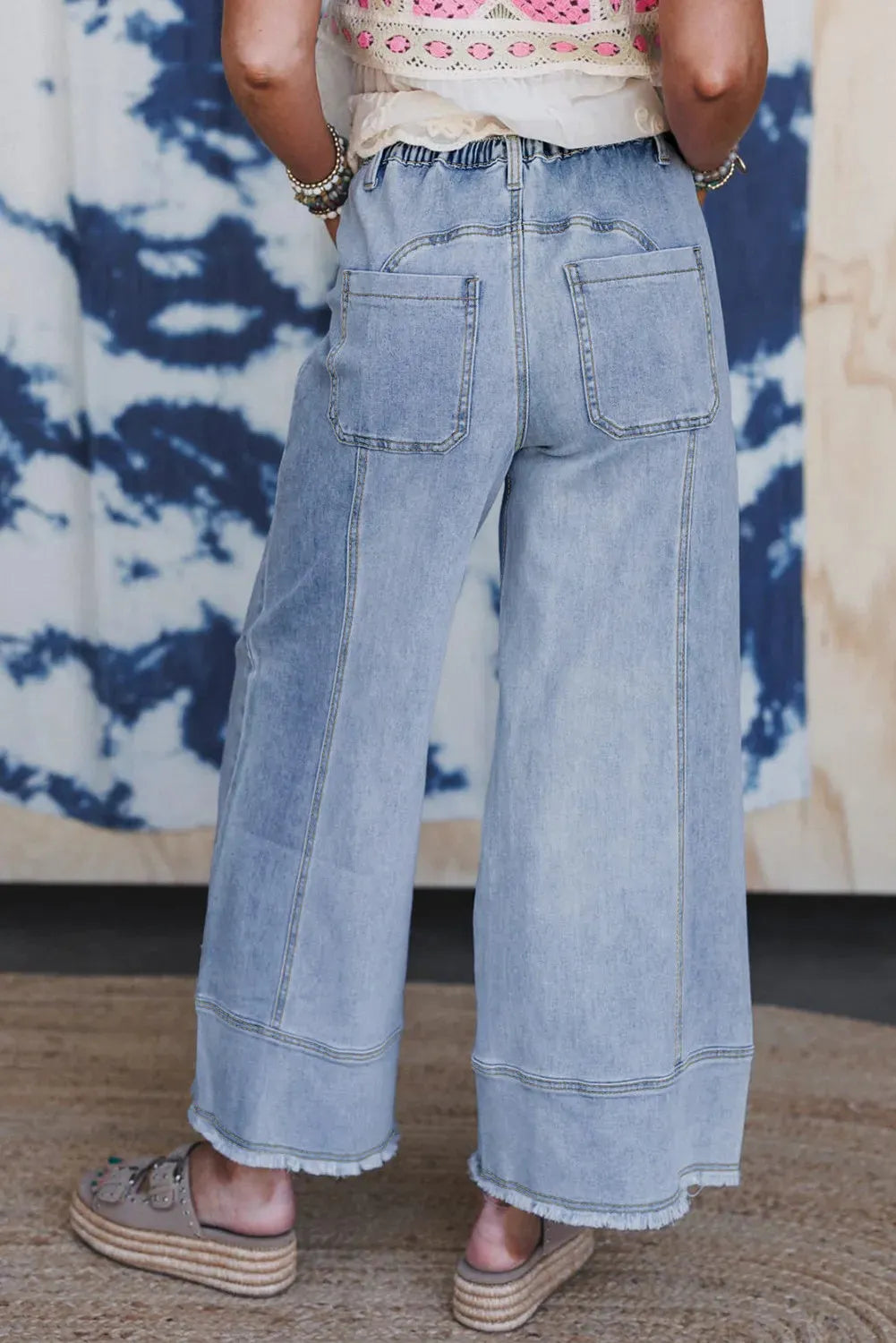 Beau blue women's wide leg denim trousers with drawstring waist and raw hem detail