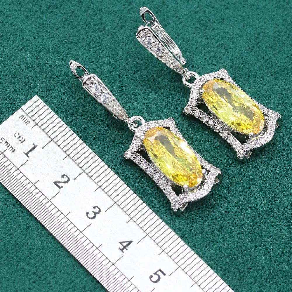 Women's olive yellow zirconia anti-allergy alloy jewellery set with necklace, earrings, ring, and bracelet.