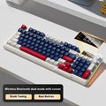 Blue and white wireless keyboard and mouse set on a desk, showing ball cap keycaps and compact design.