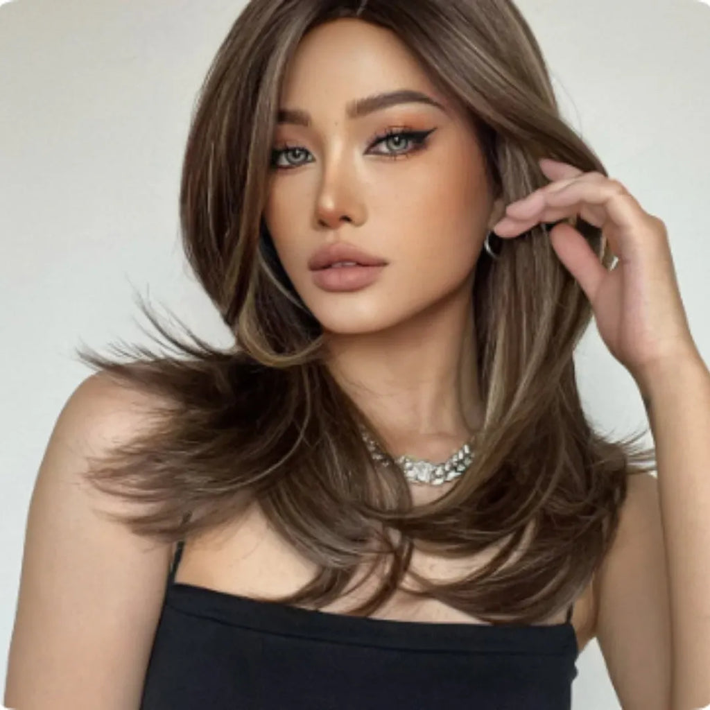 Mid-length curly synthetic wig with platinum gradient colour and long bangs