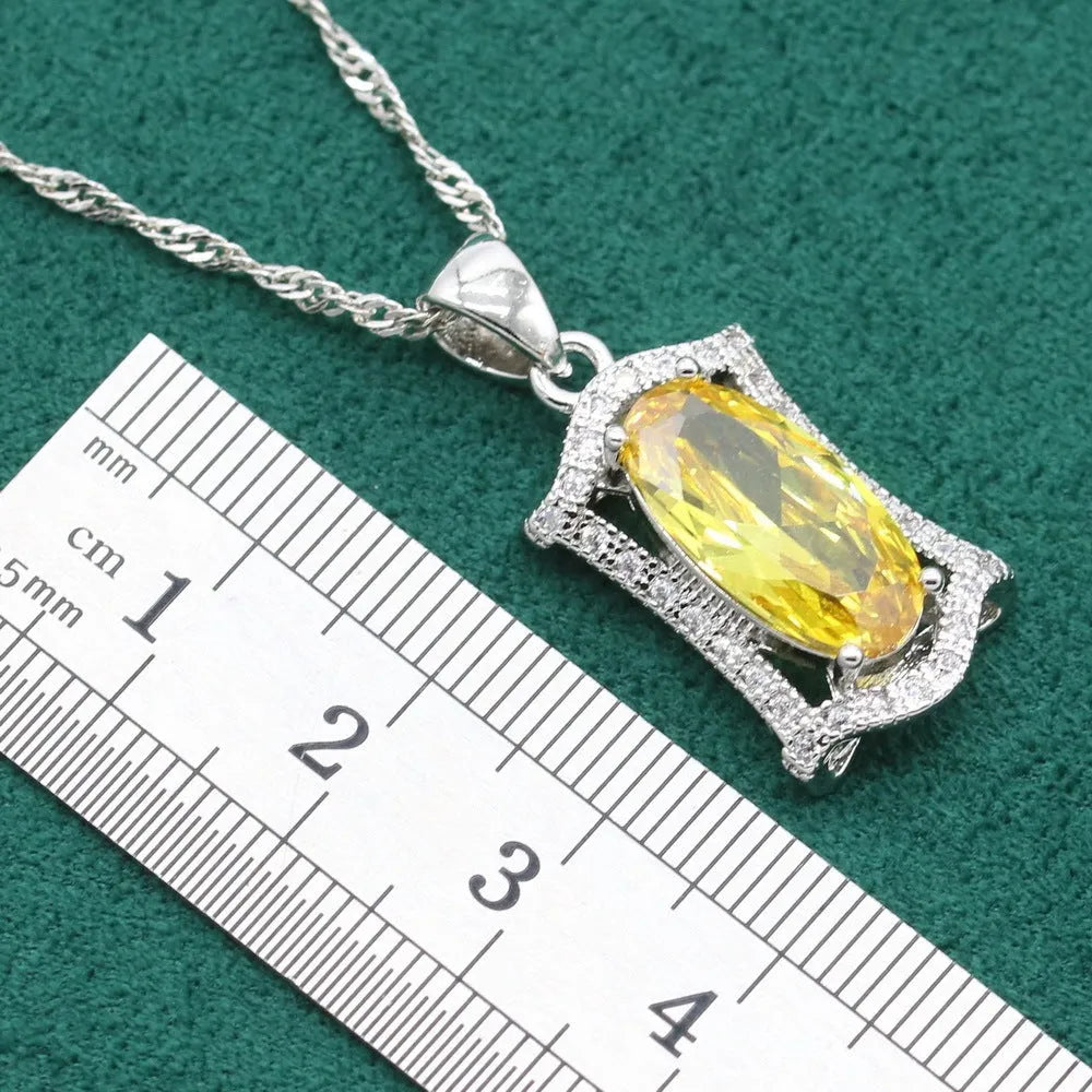 Women's olive yellow zirconia anti-allergy alloy jewellery set with necklace, earrings, ring, and bracelet.