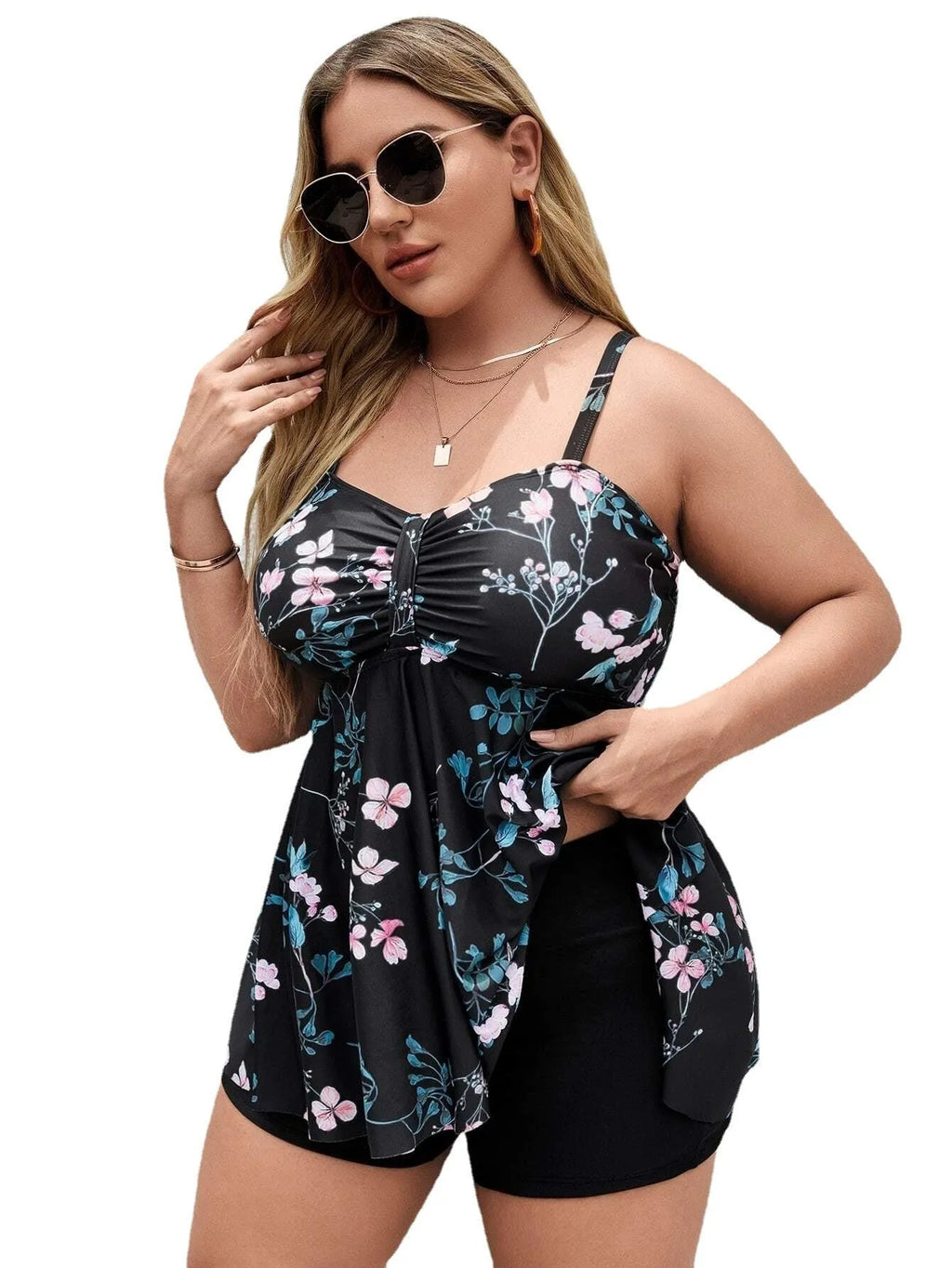 Women's one-piece floral print swimsuit in split colours on a mannequin, showing front design.