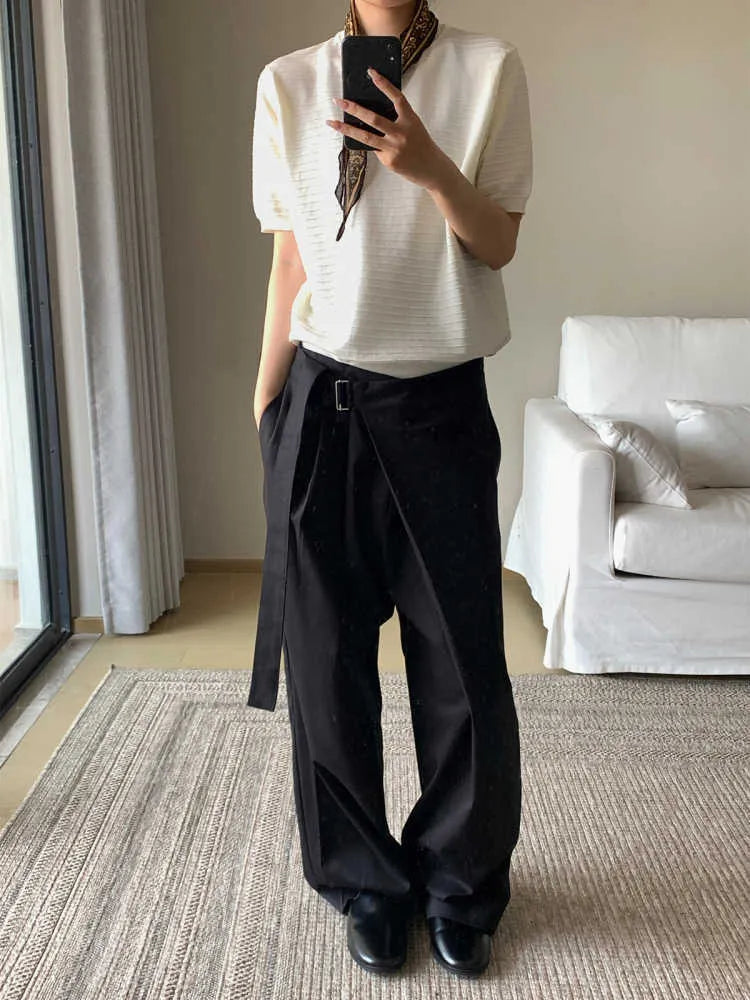 Black straight-leg women's trousers with a pleated front and adjustable waistband on a neutral background.