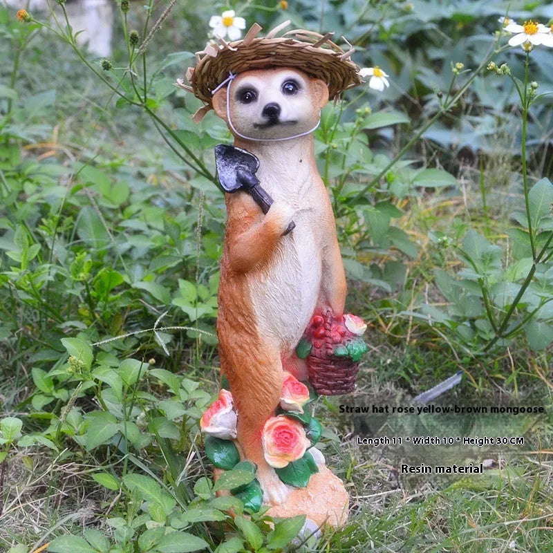 Three straw hat mongoose garden ornaments including mother and child, rake carrier, and shovel carrier designs