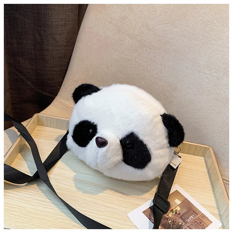 Soft plush panda head design crossbody bag shown in cylindrical shape.