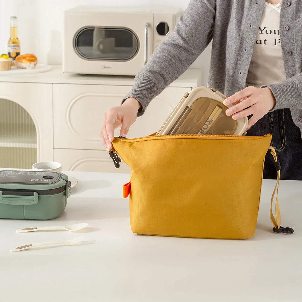 Japanese style insulated lunch bag in Oxford cloth with wide opening for food storage.