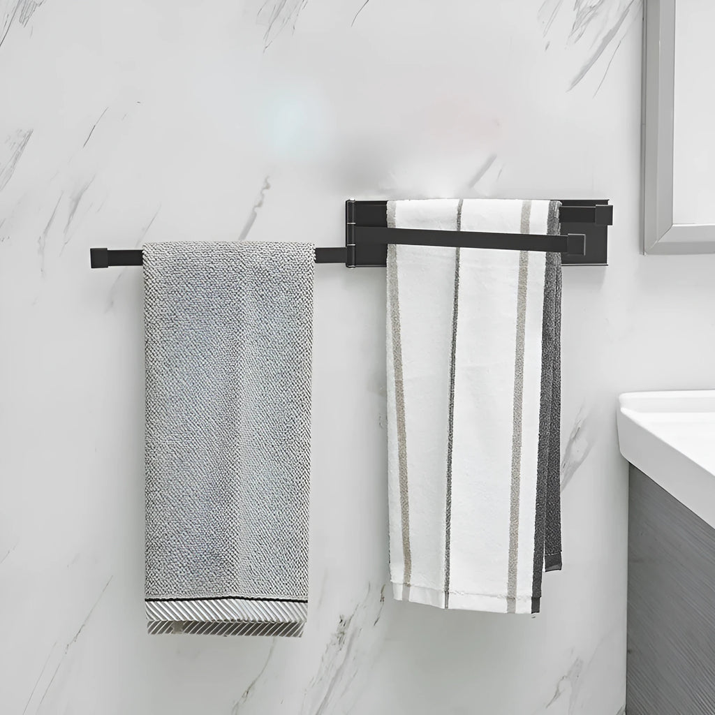 Nordic style folding towel rack in black mounted on bathroom wall with towels
