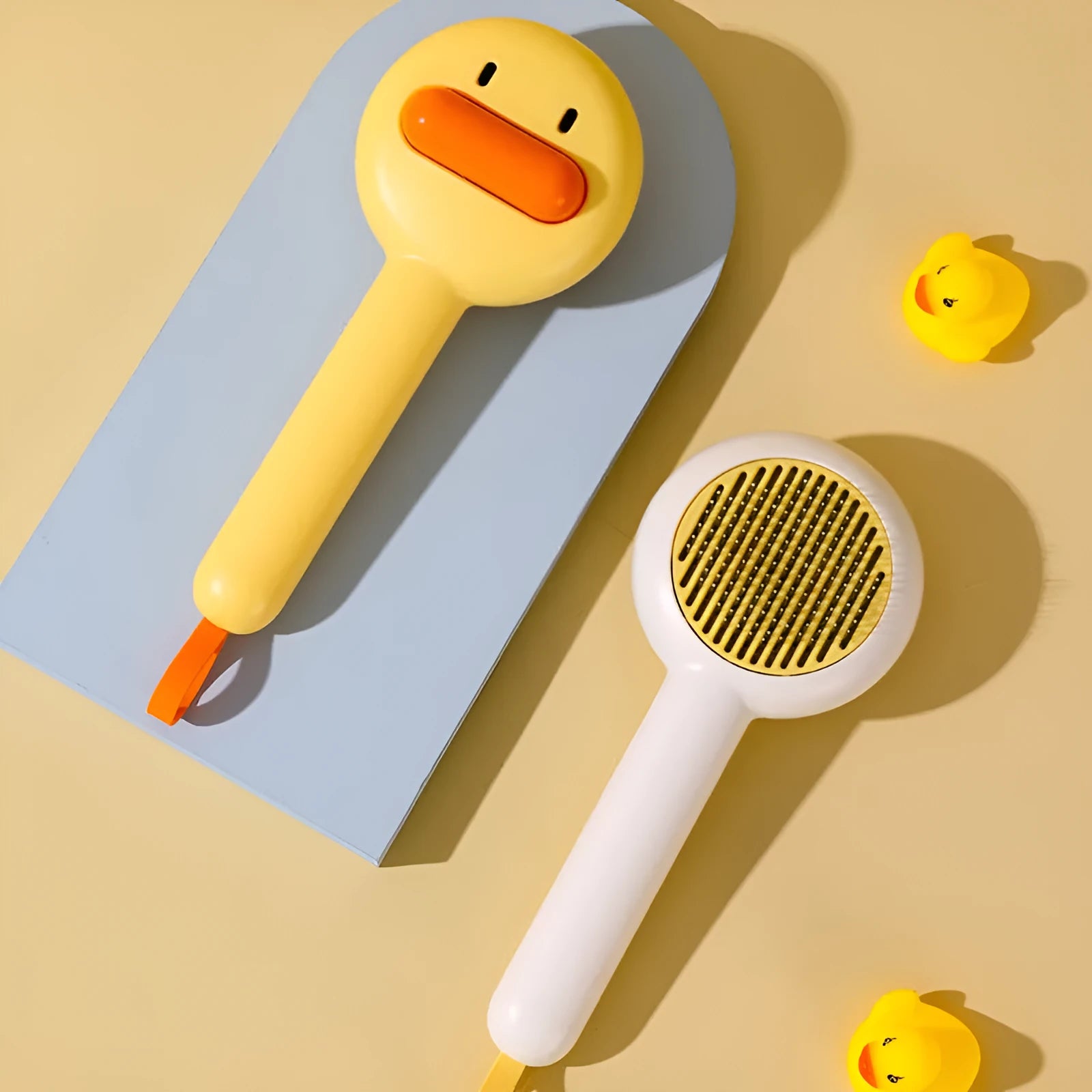 Small yellow duck design pet grooming comb with open-section needle teeth for cats and dogs