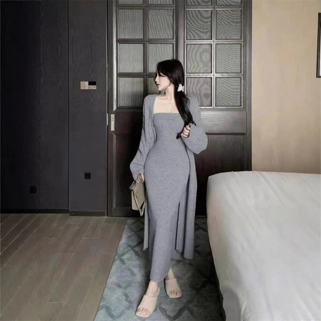 Women's grey knitted cardigan dress and coat suit set with long skirt and flocking detail.