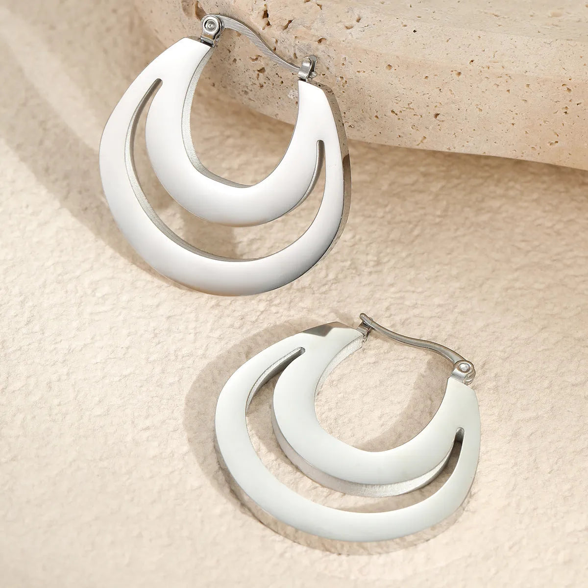 Geometric French earrings with 18K gold plating on stainless steel featuring round ring elements