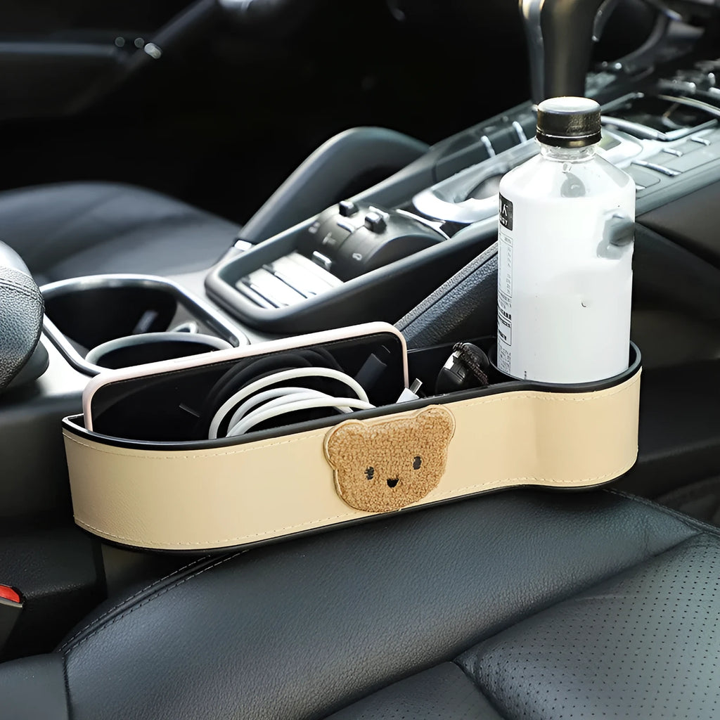 Leather car seat gap storage box with cartoon bear design for centre console organisation.