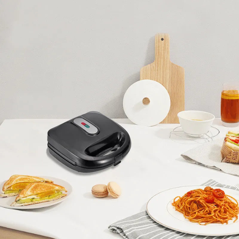 Black electric sandwich pan with double-sided heating, brushed stainless steel lid, and six non-stick cooking plates.