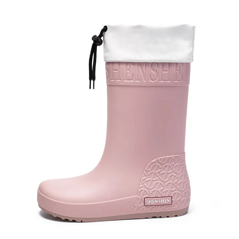 Women's solid colour PVC rain boot in apricot, shown on a white background.