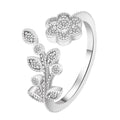 Women's open back copper ring with floral leaf design in a white diamond finish.