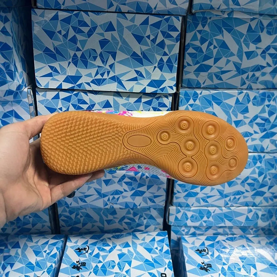 Adult football trainers with PVC upper, non-slip rubber soles, available in sizes 35-45