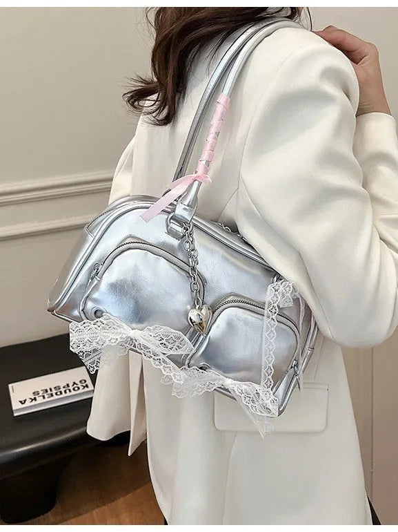 Casual shoulder bag in horizontal square design with cross-body strap, showing internal mobile phone pocket organisation