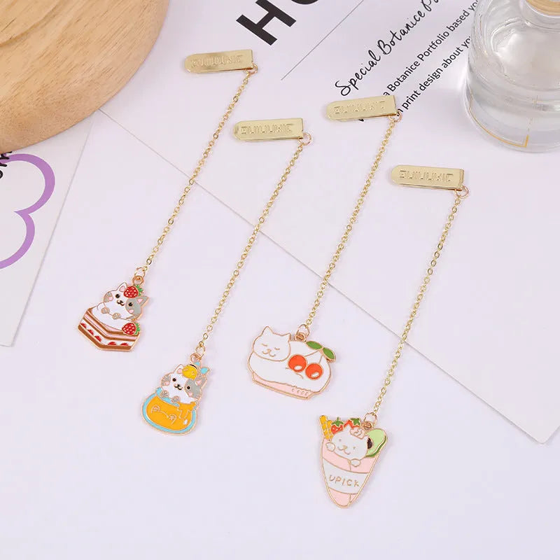 Jane Lime Foodie Cat metal bookmark with cartoon pendant in four colour variations on a white background.