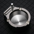 Large brushed stainless steel ashtray with sliding permanent match lighter and three cigarette slots in gold colour